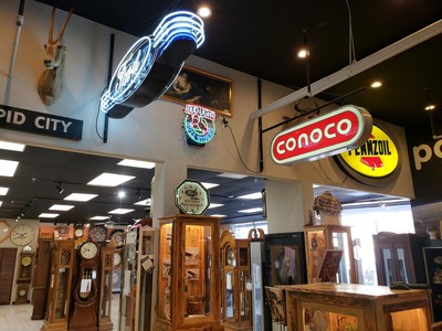 Antique signs and grandfather clocks at Presidential Pawn.
