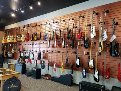 Acoustic and electric guitars at Presidential Pawn